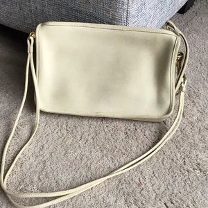 Coach vintage cross body or clutch, cream colored.